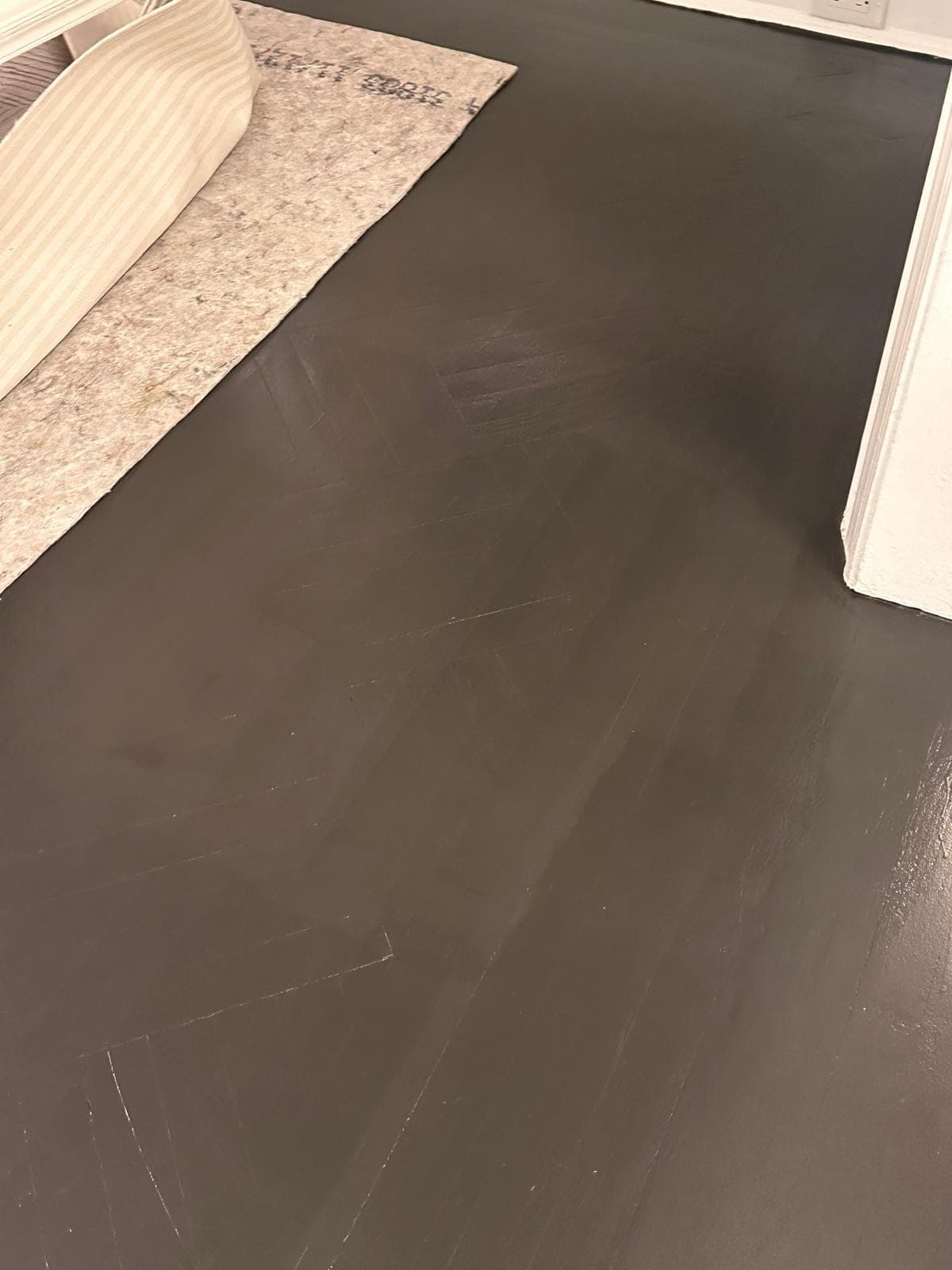 Herringbone floor refinished in a dark custom color