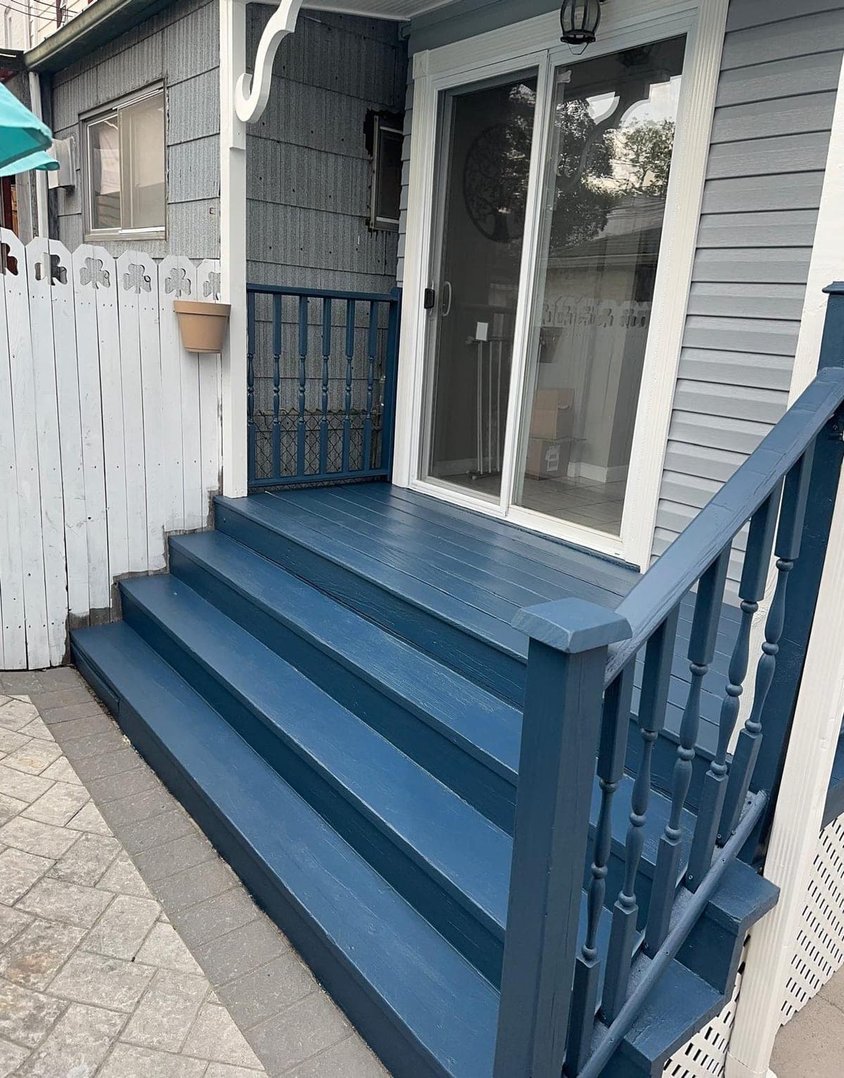 Painted blue back-deck with custom railing